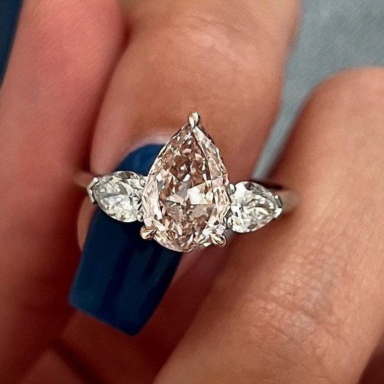 2.70 Carat Pear Cut Fancy Intense Pink Lab Grown Diamond Three Stone Ring