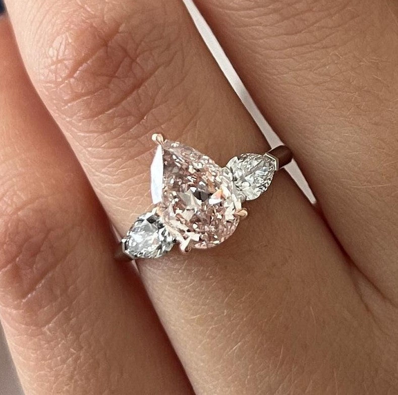 2.70 Carat Pear Cut Fancy Intense Pink Lab Grown Diamond Three Stone Ring