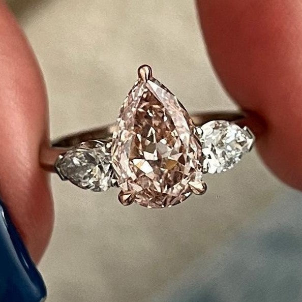 2.70 Carat Pear Cut Fancy Intense Pink Lab Grown Diamond Three Stone Ring