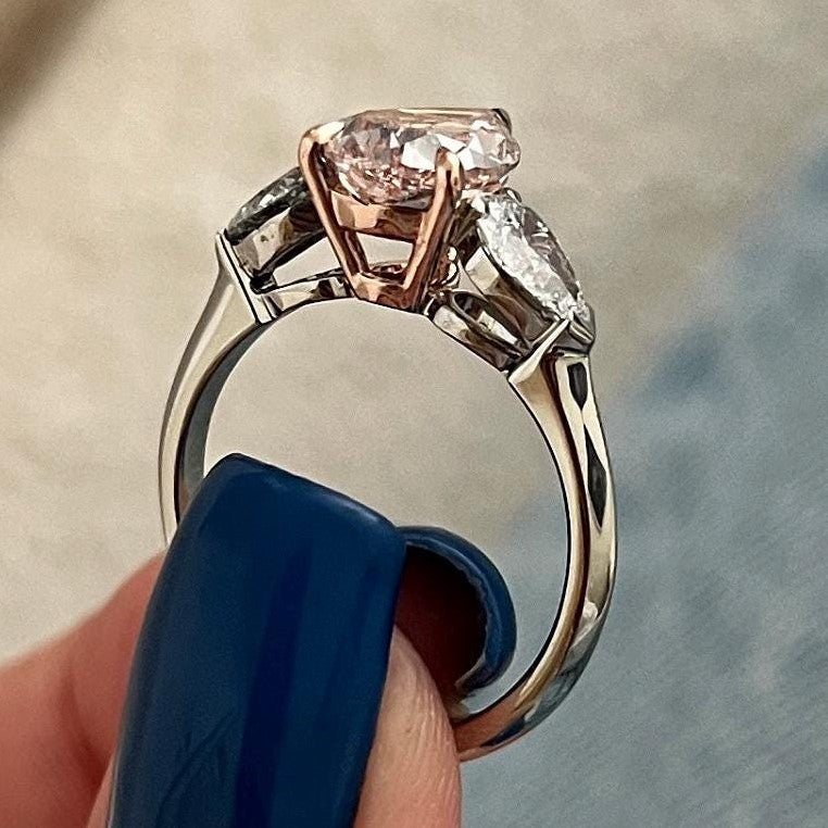2.70 Carat Pear Cut Fancy Intense Pink Lab Grown Diamond Three Stone Ring