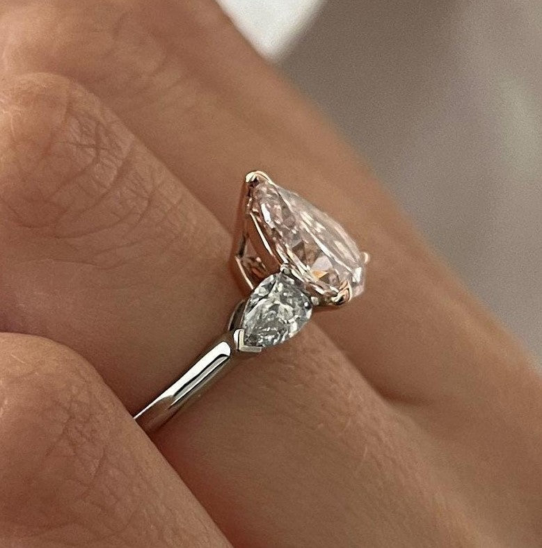 2.70 Carat Pear Cut Fancy Intense Pink Lab Grown Diamond Three Stone Ring