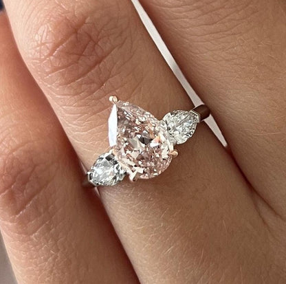 2.70 Carat Pear Cut Fancy Intense Pink Lab Grown Diamond Three Stone Ring
